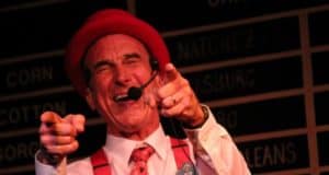 Yehaa Bob Jackson on stage at Disney’s Port Orleans Resort – Riverside, grinning, pointing, and performing in his signature red hat.
