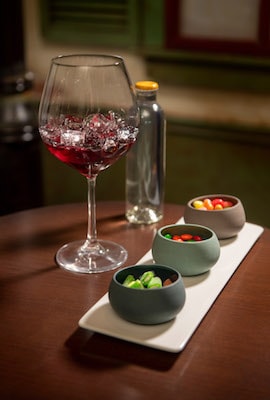 Sipping red wine and snacking on candies aboard the Disney Wonder, the perfect treat before a night of Broadway-style shows.