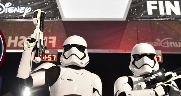 Stormtroopers with blasters pose at the Disney "Finish" line for Rival Run, energy high despite a Run Weekend Cancelled sign.