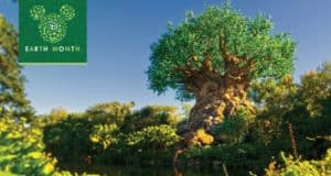 Iconic Tree of Life at Disney’s Animal Kingdom, lush greenery, clear skies; "Earth Month" logo highlights nature’s magic.