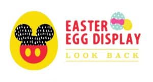Mickey-shaped yellow Easter egg and colorful decorated eggs with "Easter Egg Display Look Back" at Walt Disney World.