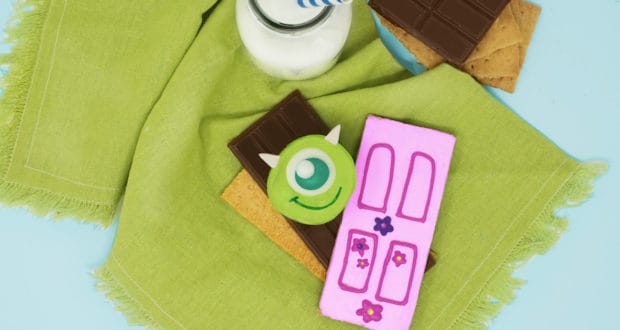 Monsters Inc.-themed s’mores with milk, chocolate, graham crackers, and decorated cookies—a Disney parks dessert delight.