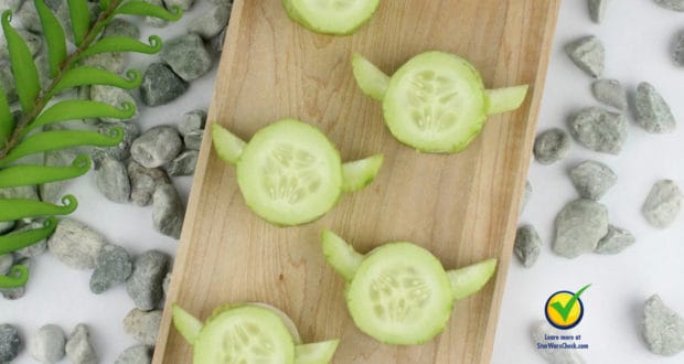 Yoda-shaped cucumber bites on a wooden board, perfect Star Wars snacks for fans visiting Galaxy’s Edge at Disney Parks.