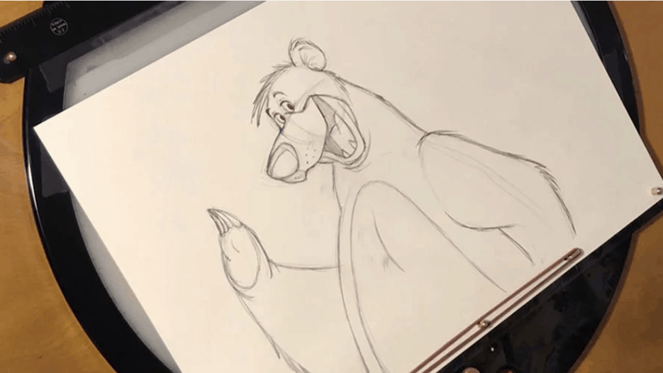 Baloo from The Jungle Book, sketched in pencil on white paper atop a drawing board—ideal inspiration for Disney fans and artists.
