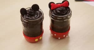 Disney-inspired Mickey & Minnie cake jars with Oreo ears and red accents—perfect for adding magic to your next Disney movie night.