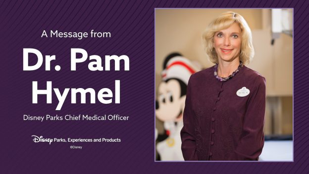 Dr. Pam Hymel smiles as Disney Parks’ Chief Medical Officer in an official update, with Mickey Mouse blurred in the background.