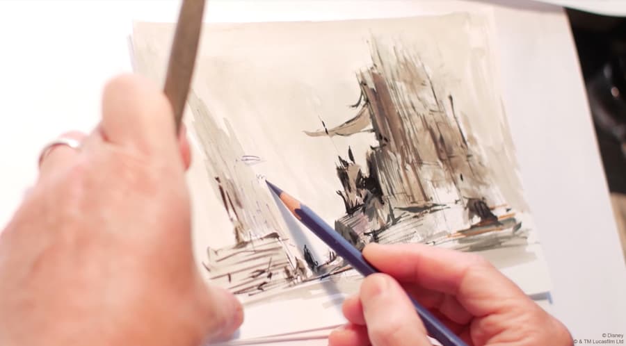 Inspired by Disney Imagineering, a guest uses STEAM skills to design a building with pencil and ruler at a theme park workshop.