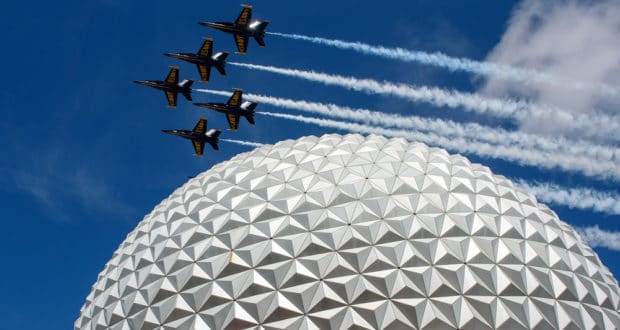Jets soar above Epcot’s iconic sphere, painting the sky with smoke trails during a thrilling Armed Forces Day tribute.