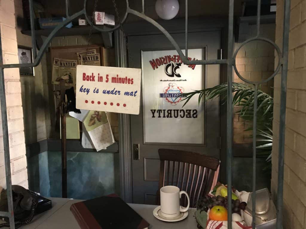 A playful office door sign, like those at Disney’s Hollywood Studios, says: “Back in 5 minutes, key is under mat.”.