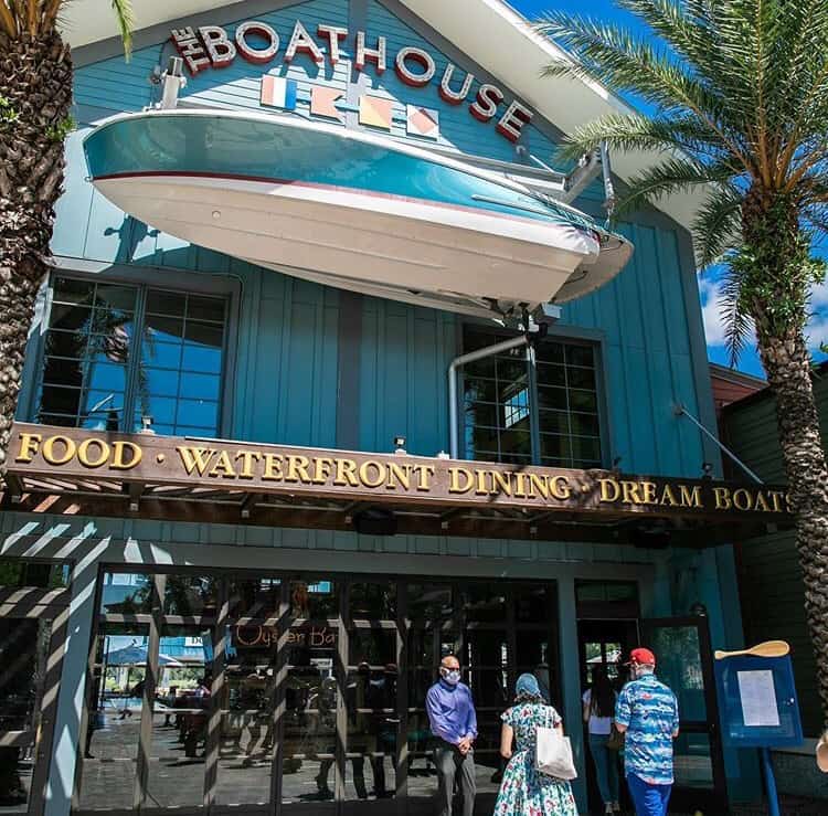 The iconic Boathouse building, topped with a boat, creates a whimsical photo spot for Disney fans enjoying Disney Springs.