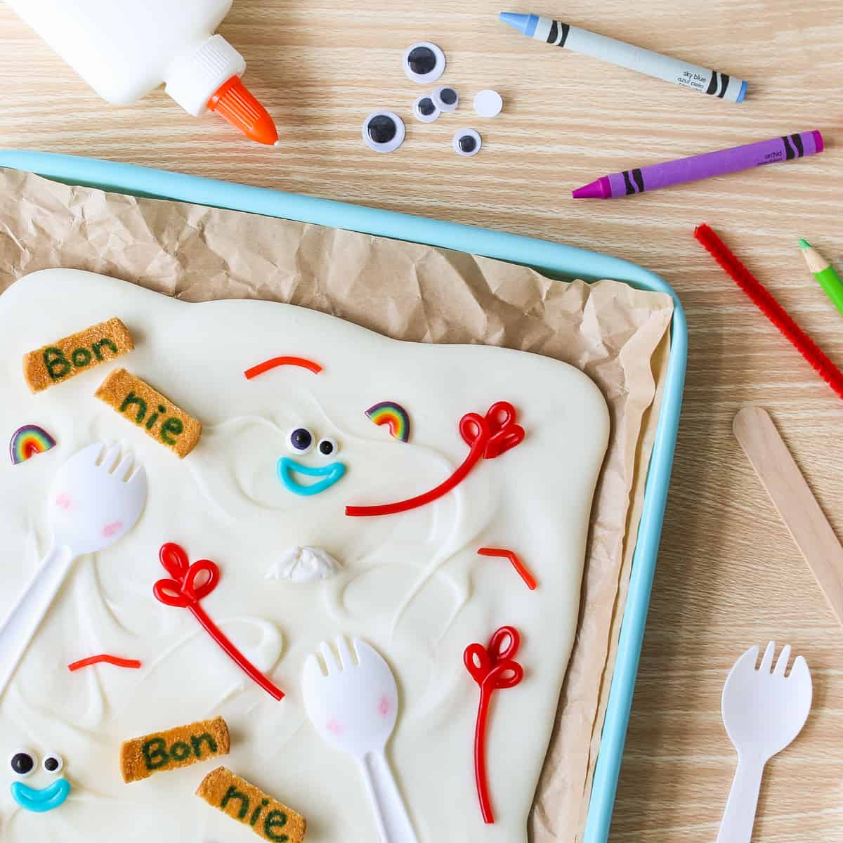 Whimsical art supplies and Toy Story-inspired snacks with Forky faces set out like a Pixar Fest table at Disney Parks.