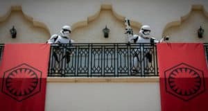 Stormtroopers patrol a Disney Springs balcony as bold First Order banners drape above the crowd, adding galactic flair.