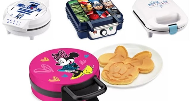 Five Disney character waffle makers, including a Mickey-shaped waffle up front. Available now at shopDisney—perfect for fans!.