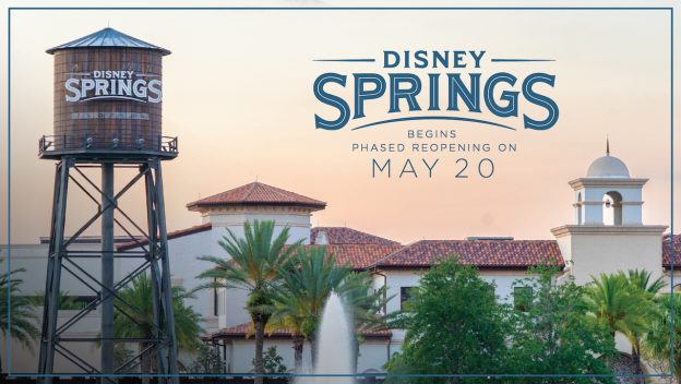 Disney Springs water tower and lively shops, with a sign welcoming guests back for the phased reopening starting May 20.