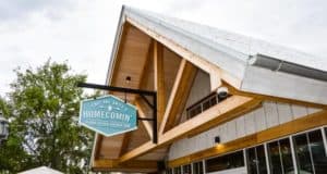 Homecomin’ Florida Kitchen shines at Disney Springs with its charming, rustic facade—a must-visit for Disney foodies.