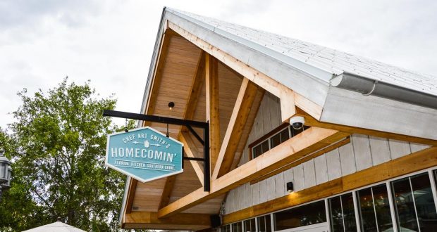 Homecomin’ Florida Kitchen shines at Disney Springs with its charming, rustic facade—a must-visit for Disney foodies.