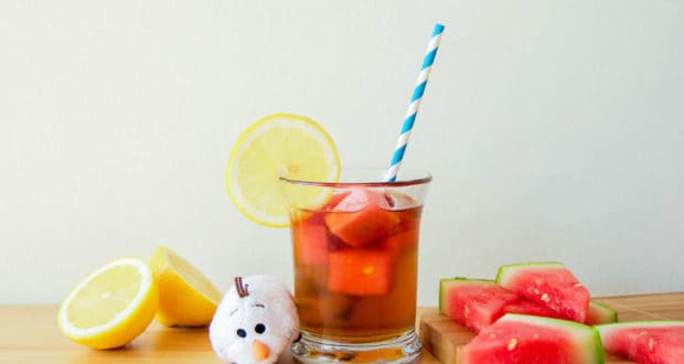 Olaf plush with iced tea, watermelon slices, and Watermelon Ice Cubes at Disney parks—refreshing summer magic!.
