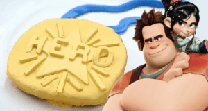 The Hero Medal Cookie gleams beside Ralph and Vanellope, star characters from Wreck-It Ralph at Disney Parks.