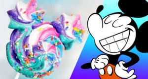 A vibrant swirled lollipop with sprinkles pops beside a cheerful Mickey Mouse, perfect for your next Disney parks treat idea.
