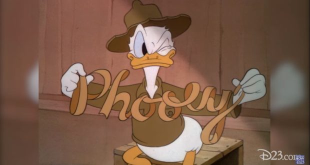 Donald Duck in a brown outfit shows off a “phooey” ribbon—one of his hilarious Quackiest Moments straight from Disney magic!.