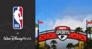 NBA logo and Walt Disney World signage at ESPN Wide World of Sports, framed by palm trees and a sunny Florida sky.