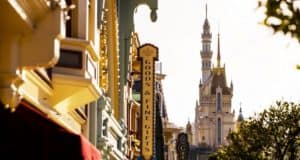 Main Street’s colorful shop signs and iconic castle shine under sunny skies at Hong Kong Disneyland—the ultimate selfie spot.