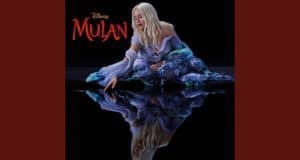 Mulan, in her iconic flowing dress, reaches toward her reflection beneath the Disney Mulan logo, channeling "Reflection.