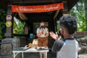 A child interacts with a Wilderness Explorer Station at Disney's Animal Kingdom Theme Park