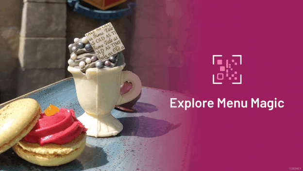 A whimsical teacup dessert and macaron on a plate, with "Explore Menu Magic" and a QR code, perfect for theme park treats.