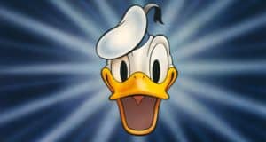 Donald Duck’s cheerful face with wide eyes, open beak, and signature sailor hat pops against a blue starburst background—an iconic Disney character who brings the magic of Disney Parks to life for fans and aspiring cast members.