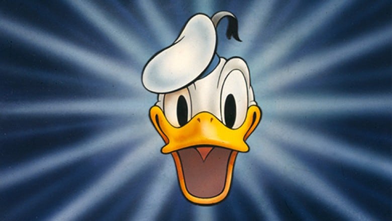Donald Duck’s cheerful face with wide eyes, open beak, and signature sailor hat pops against a blue starburst background—an iconic Disney character who brings the magic of Disney Parks to life for fans and aspiring cast members.