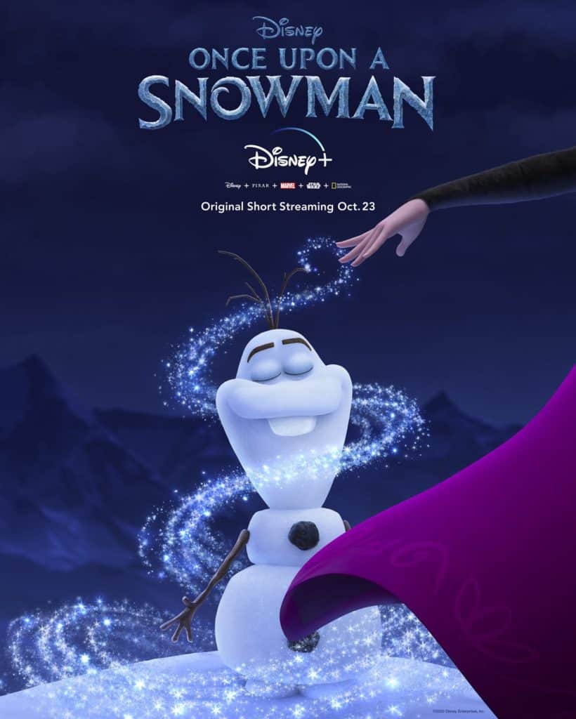 Olaf beams with joy as magical sparkles swirl around him, while a hand in a purple sleeve reaches out—capturing the whimsical spirit of Disney+’s Once Upon a Snowman, reminiscent of the enchanting moments guests experience at Disney Parks.