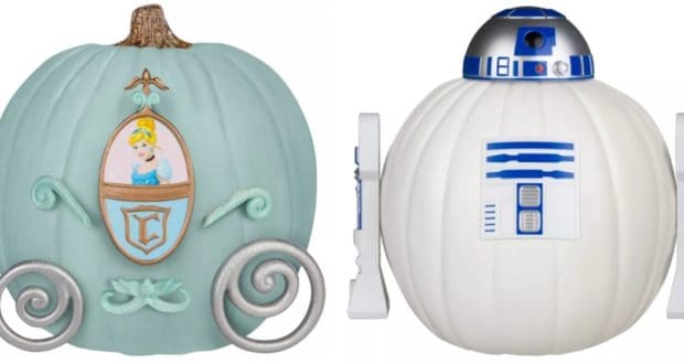 A Cinderella carriage pumpkin inspired by Disney magic and crafted with Disney Pumpkin Decorating Kits from Target stands beside an R2-D2 pumpkin showcasing Star Wars creativity—perfect for fans of both classic fairy tales and galactic adventures.