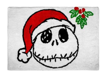 White bath mat featuring Jack Skellington’s skull sporting a Santa hat with holly and red berries in the corner, perfect for fans wanting to bring some Nightmare Before Christmas magic from Disneyland into their home decor.