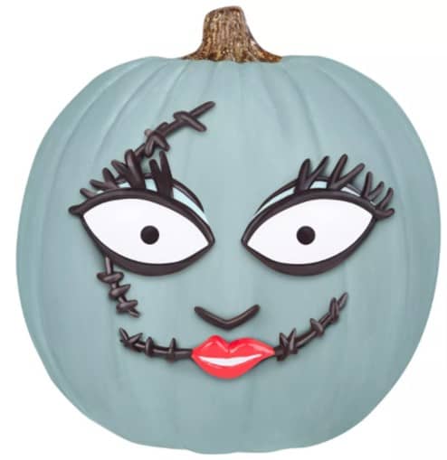 Blue pumpkin styled with oversized cartoon eyes, a stitched mouth, and bold red lips, capturing the whimsical character design fans love from The Nightmare Before Christmas—an eye-catching addition to your Halloween festivities at Disney Parks or Universal Studios, especially for guests seeking themed no-carve pumpkin fun.