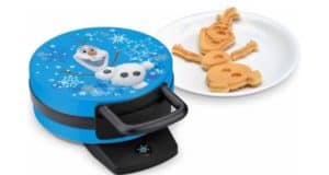 Disney’s Olaf Waffle Maker, inspired by Frozen, sits beside a whimsical Olaf-shaped waffle—perfect for adding a bit of Disney magic to your breakfast at home. Find it at Walmart for just $20.