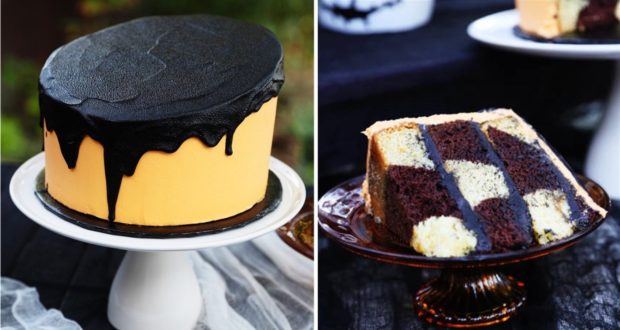 Nightmare Before Christmas-themed cake with vibrant orange frosting and dramatic black drip, reminiscent of a Tim Burton-inspired treat from Disney Parks. A cut slice reveals a magical checkerboard pattern of chocolate and vanilla layers inside.