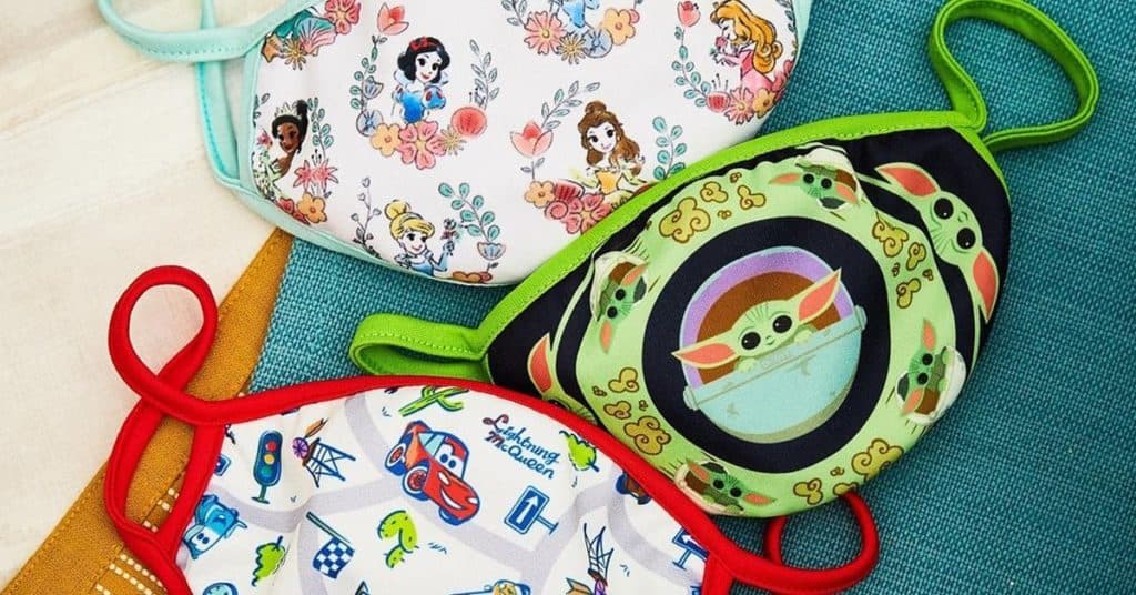 Disney-themed kids’ face masks with vibrant character designs from BoxLunch, perfect for your next magical park adventure, on display.