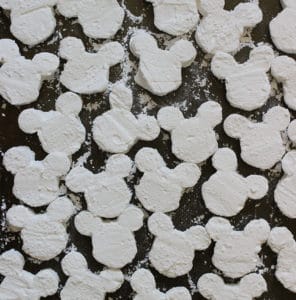 Mickey Mouse-shaped marshmallows dusted with powdered sugar, ready for you to create magical Mickey s'mores—these sweet treats bring the whimsy of Disney parks right to your kitchen, capturing the spirit of a campfire treat with a touch of pixie dust.