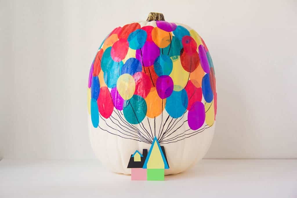 A whimsical white pumpkin adorned with vibrant balloon stickers and a tiny paper house at the base, channeling the magic of Pixar’s "Up"—this no-carve creation is a must-have for any Disney Parks fan looking to bring cinematic charm to their collection of Disney-inspired pumpkins.