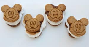 Experience the fun of Disney snacks with four Mickey S'mores—classic campfire treats featuring cookies shaped like Mickey Mouse, each filled with gooey marshmallow and rich chocolate.