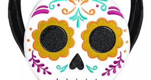 Loungefly Coco sugar skull backpack featuring bold floral designs and black straps, spotted at Disneyland—perfect for Disney and Pixar fans seeking a vibrant park accessory.