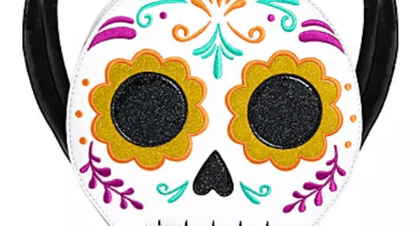 Loungefly Coco sugar skull backpack featuring bold floral designs and black straps, spotted at Disneyland—perfect for Disney and Pixar fans seeking a vibrant park accessory.