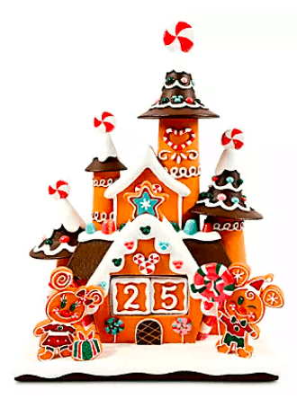 Celebrate the holidays Disney-style with a festive gingerbread house featuring icing, candy accents, and a prominent "25" on the front, surrounded by charming gingerbread figures of Mickey and Minnie Mouse from the Holiday Collection—perfect for fans visiting Disney Parks.