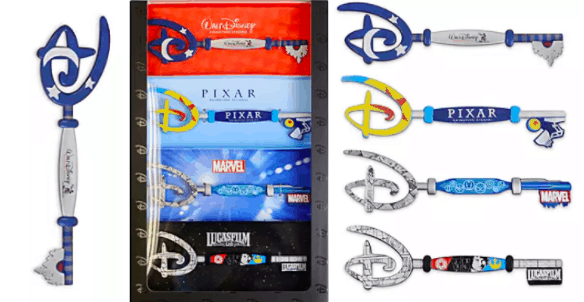 Step into the magic with the Collectable Key Set, featuring six vibrant Disney keys inspired by favorite realms like Disney Parks, Pixar, Marvel adventures, and galaxy-spanning Lucasfilm sagas—all showcased in a stunning display box. Available exclusively at shopDisney, this set pays tribute to iconic worlds guests love exploring at Disney’s destinations—an ideal keepsake for theme park fans and collectors celebrating cherished stories.
