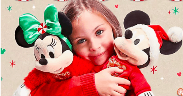 A joyful young guest embraces festive holiday Minnie and Mickey Mouse plushes, surrounded by vibrant seasonal decorations at a Disney Park.