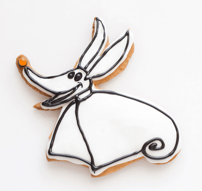 Jack Skellington’s loyal companion Zero is reimagined as a whimsical sugar cookie, featuring white icing, bold black outlines, and an orange nose—an enchanting Nightmare Before Christmas treat to bring Halloween Town magic straight to your theme park sweet selection.