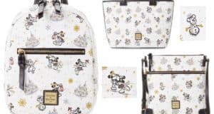 Dooney & Bourke white bags featuring festive Disney characters like Minnie and Mickey Mouse enjoying winter magic, with sparkling snowflakes and enchanting castle backdrops reminiscent of Disneyland or Disney World; finished with elegant gold and black accents that highlight signature Disney style.