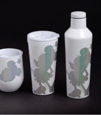 Three white Corkcicle cups featuring pastel glitter poodle patterns sit against a black backdrop, their design inspired by Minnie Mouse’s signature whimsy—perfect for Disney fans looking to bring a touch of Minnie magic to their drinkware collection.