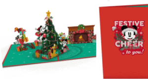 Pop-up card showcasing Mickey & Friends from the Disney Parks as they gather to decorate a Christmas tree, with the cover wishing "Festive cheer to you!"—a magical LovePop Card ideal for fans celebrating a Disney-themed Christmas.